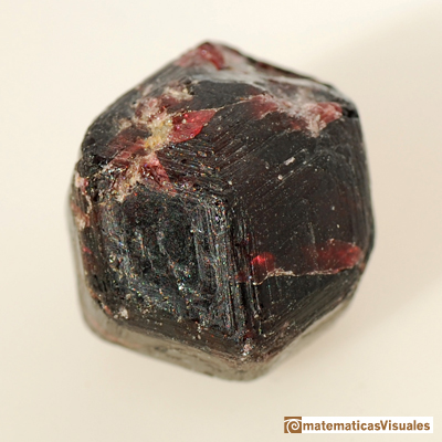 Garnet with the shape of a rhombic dodecahedron.