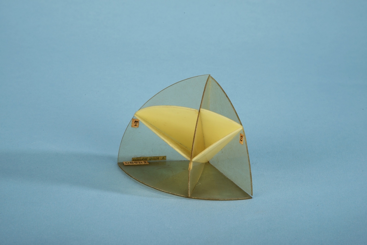 Model of a spherical triangle with military applications by A. Harry Wheeler.